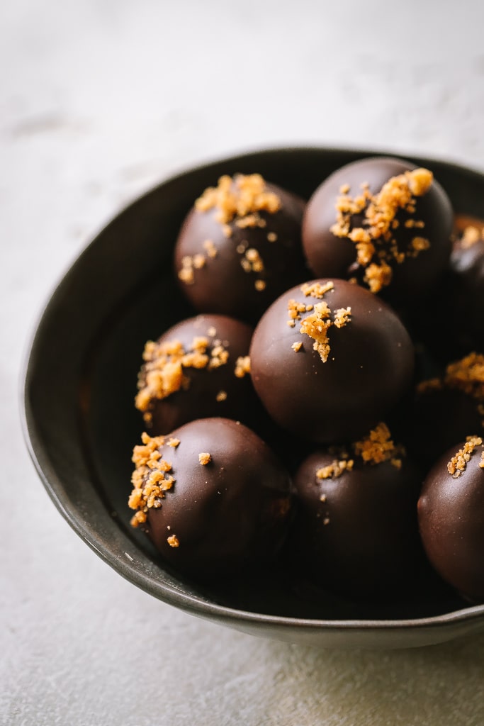 chocolate covered Pumpkin Pie Truffles in a small bowl 