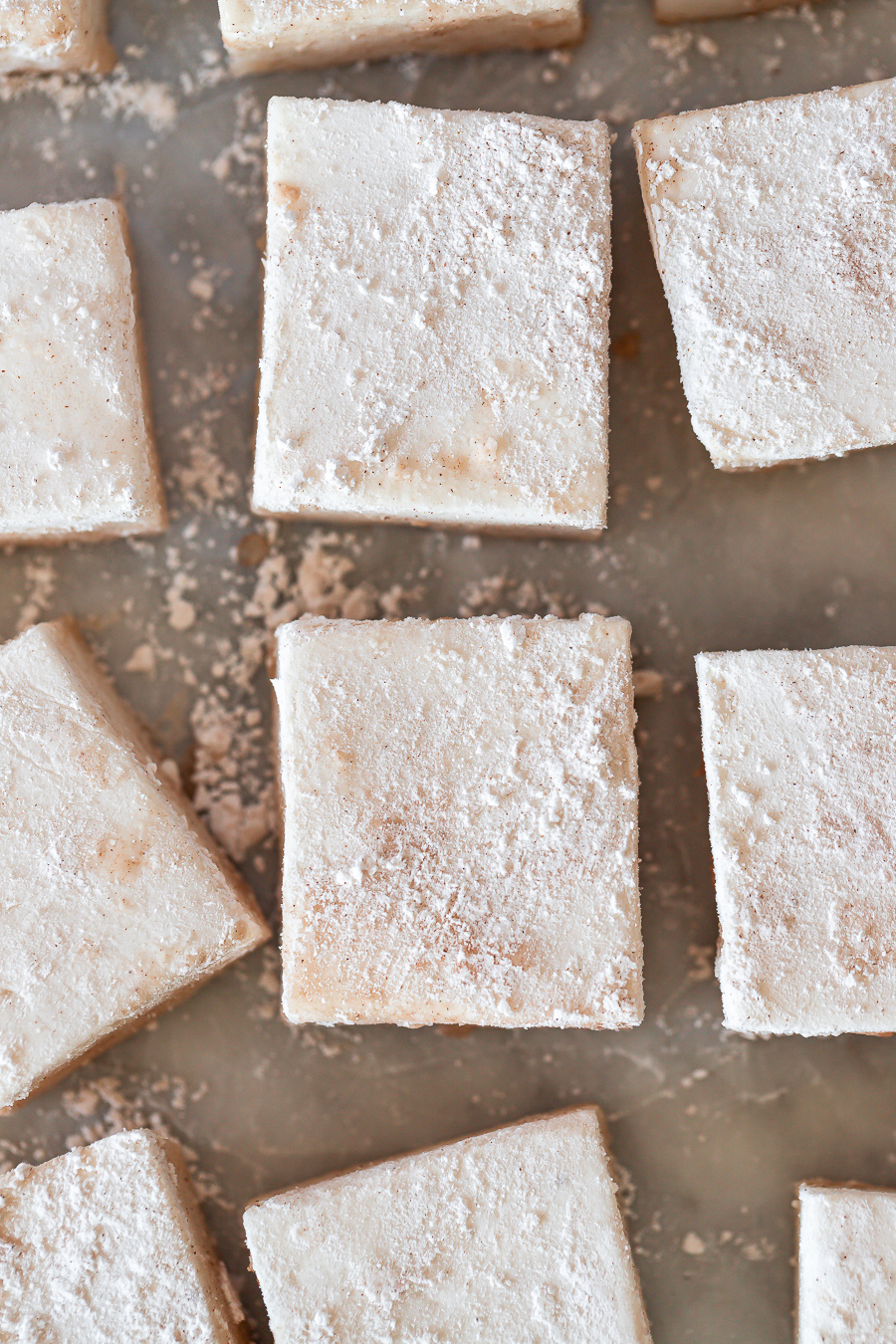 overhead shot of vegan eggnog marshmallows dusted with icing sugar