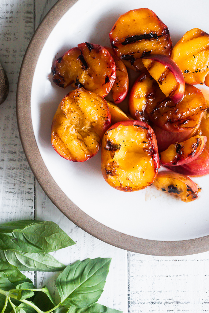 a plate of grilled peaches