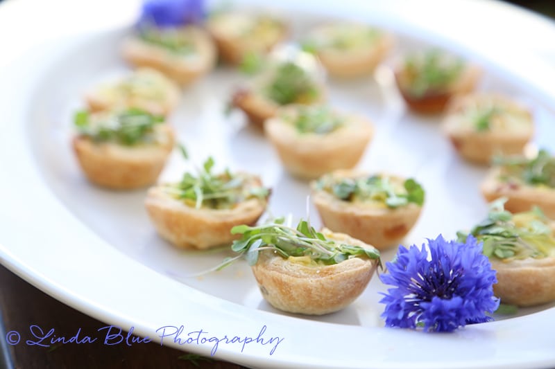Leek Asparagus Quiche Bites on a white platter