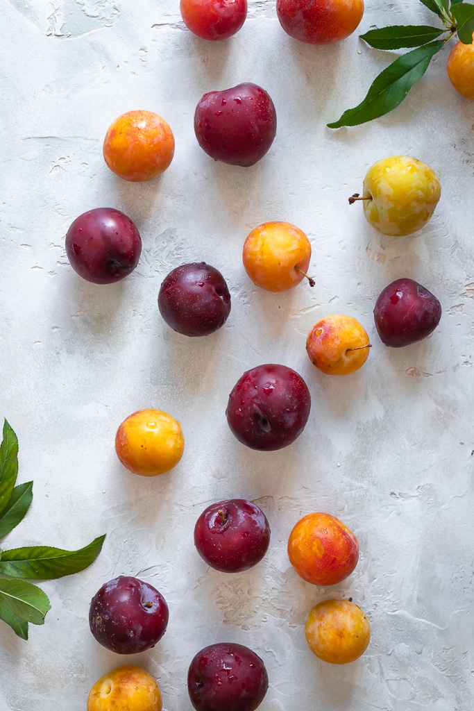 yellow and red plums