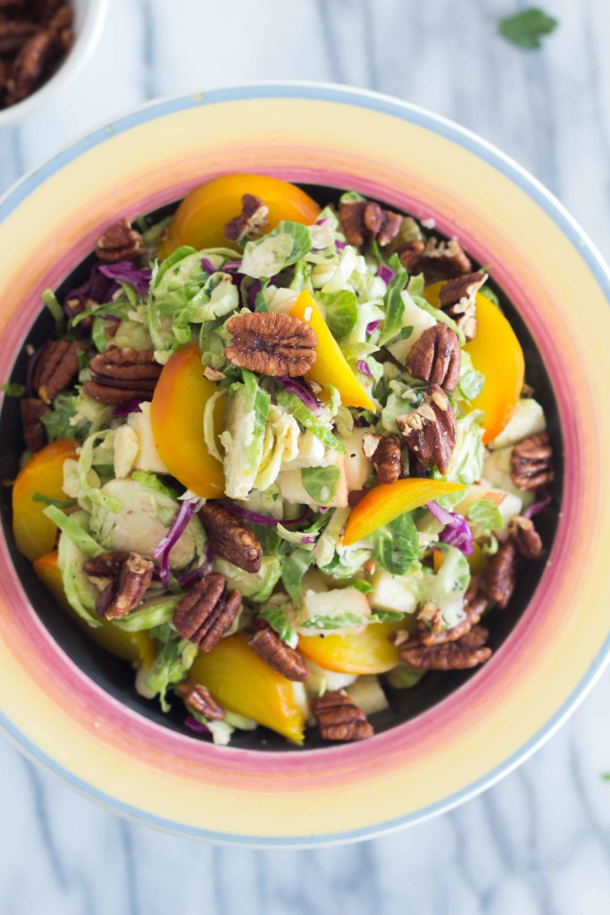 overhead shot of Autumn Brussels Sprout Slaw on a marble countertop 