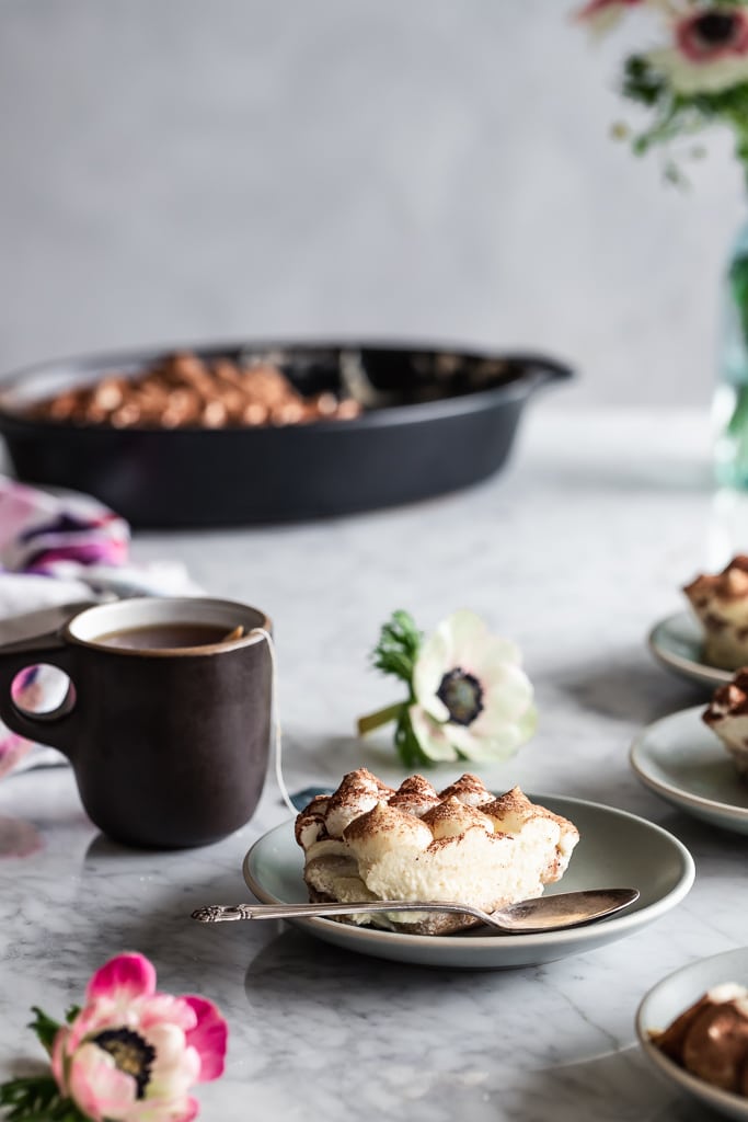 Earl Grey Tiramisu on a dessert plate with a cup of Earl Grey Tea