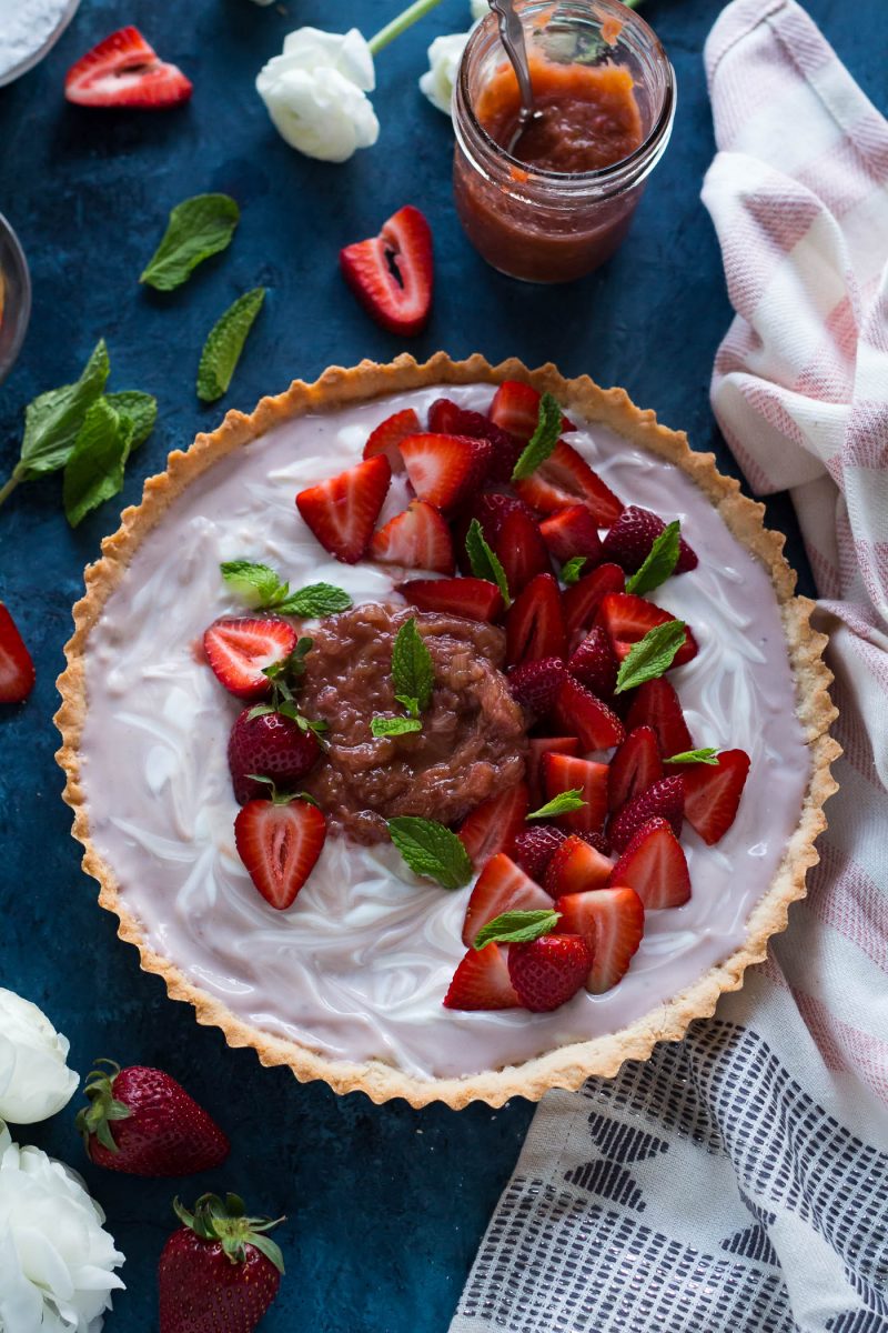 overhead shot of dairy-free Strawberry Vanilla Yogurt Tart topped with rhubarb compote