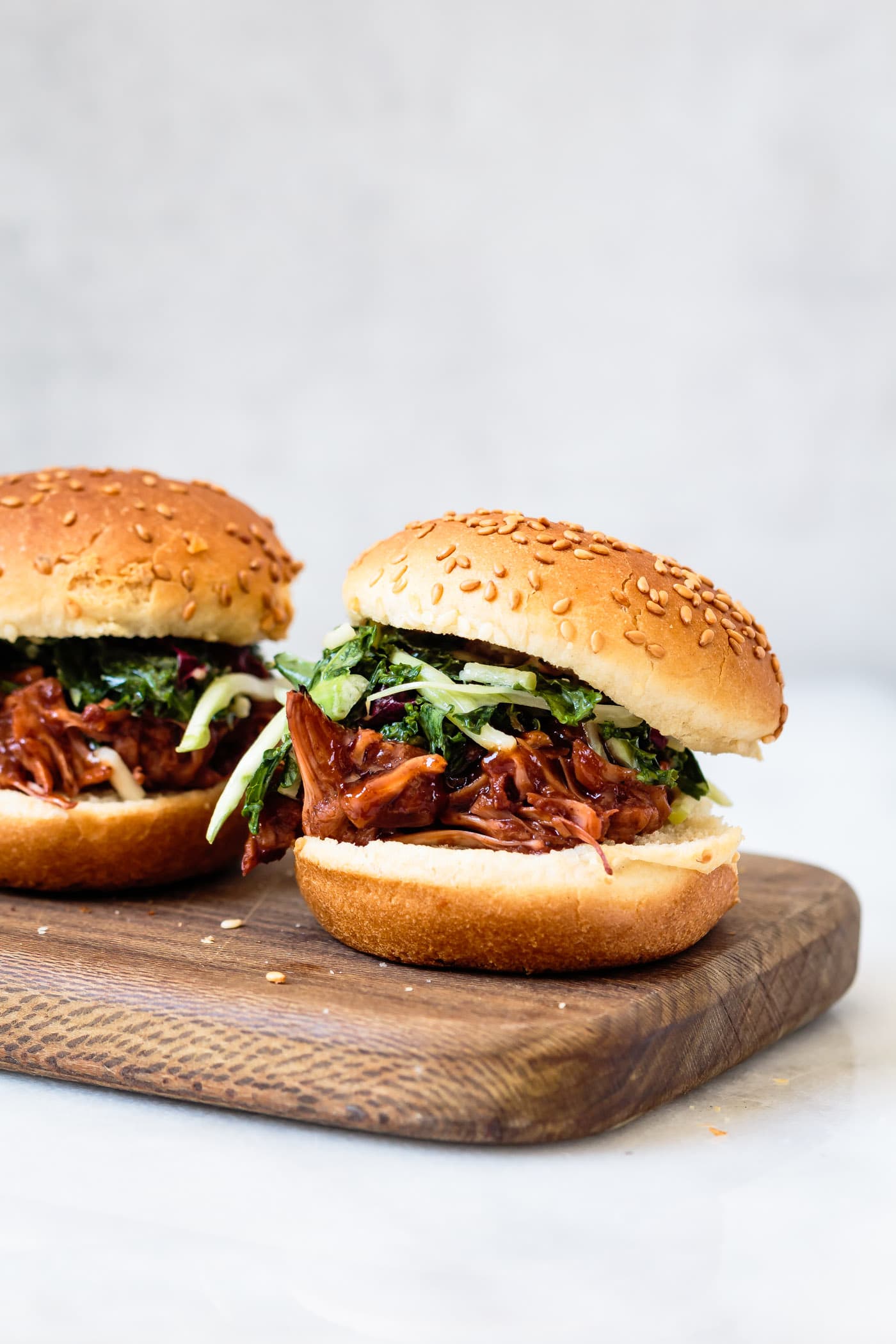 close-up side view of Jackfruit Pulled Pork Sliders with slaw and Chipotle Cherry BBQ Sauce