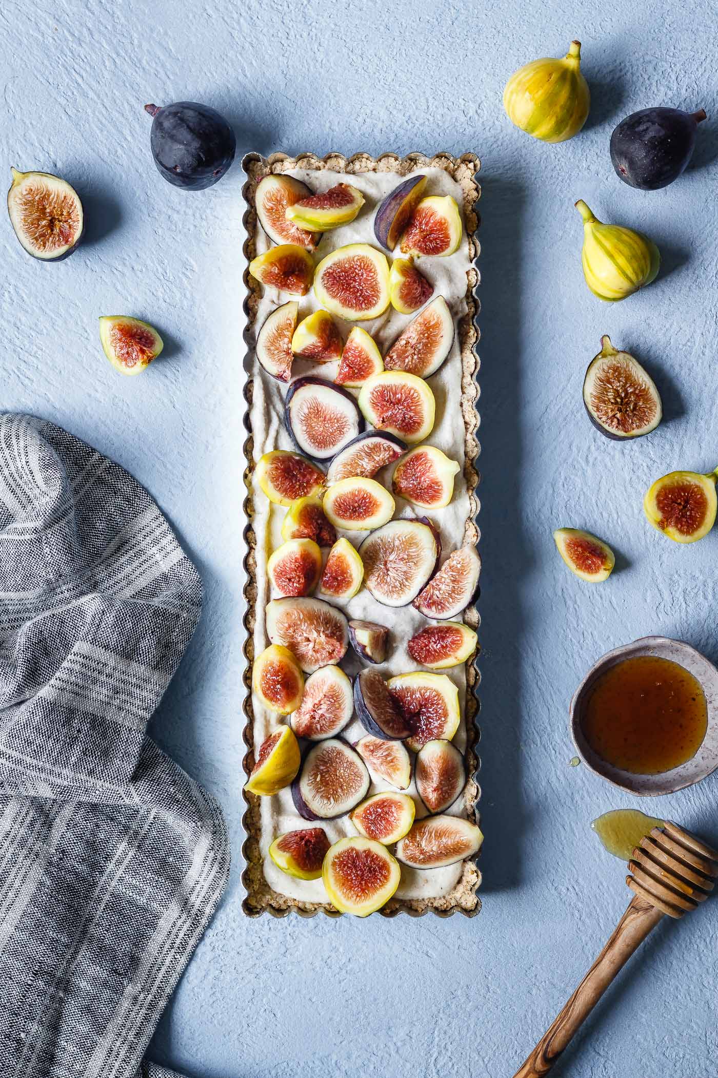 overhead shot of an easy Fig Tart with dairy-free cashew cream, fresh figs and honey