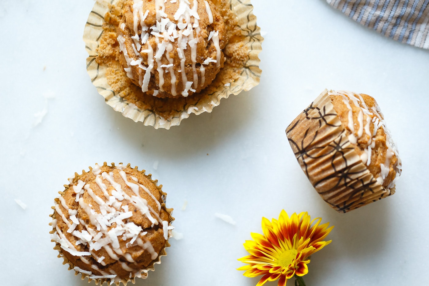 overhead shot of three Sweet Potato Coconut Chai Muffins