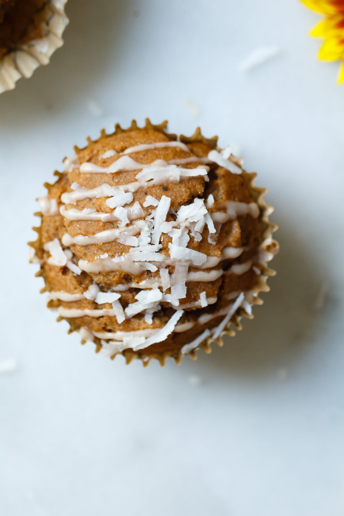 overhead close up of Sweet Potato Coconut Chai Muffins with glaze