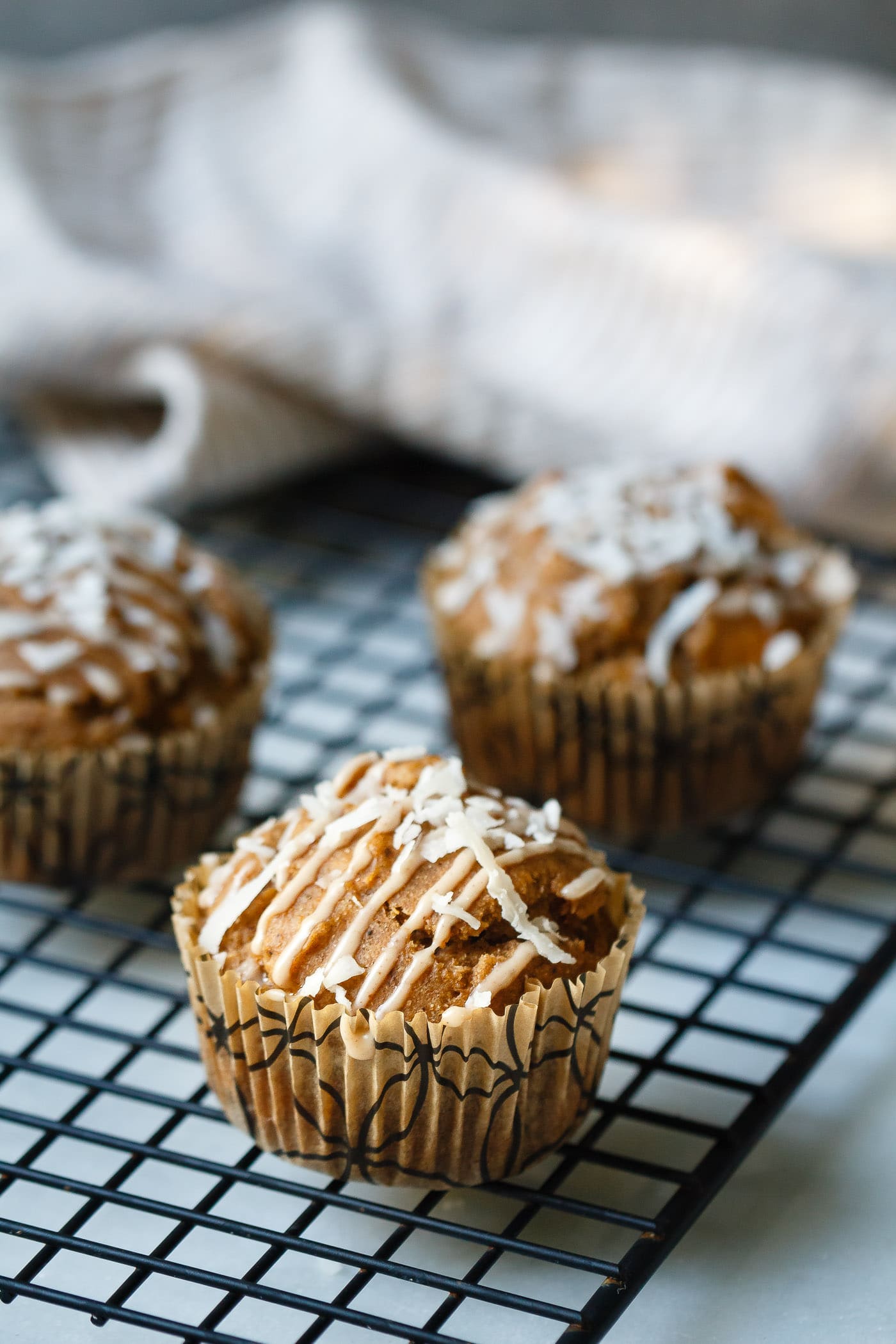 Sweet Potato Coconut Chai Muffins on a cooling rack