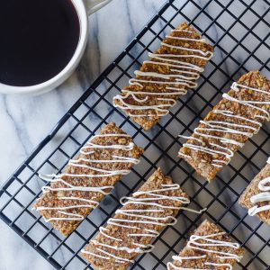 Carrot Cake Breakfast Bars on cooling rack with maple coconut icing