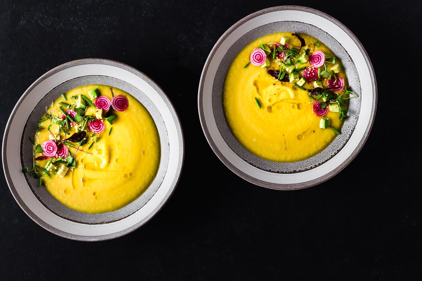 two plates of Golden Beet Gazpacho with decoration