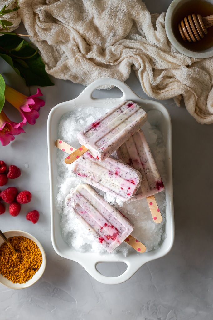 overhead shot of healthy homemade raspberry chia pudding popsicles