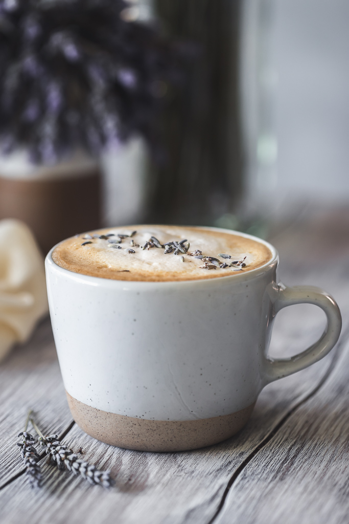 Lavender latte in a coffee mug
