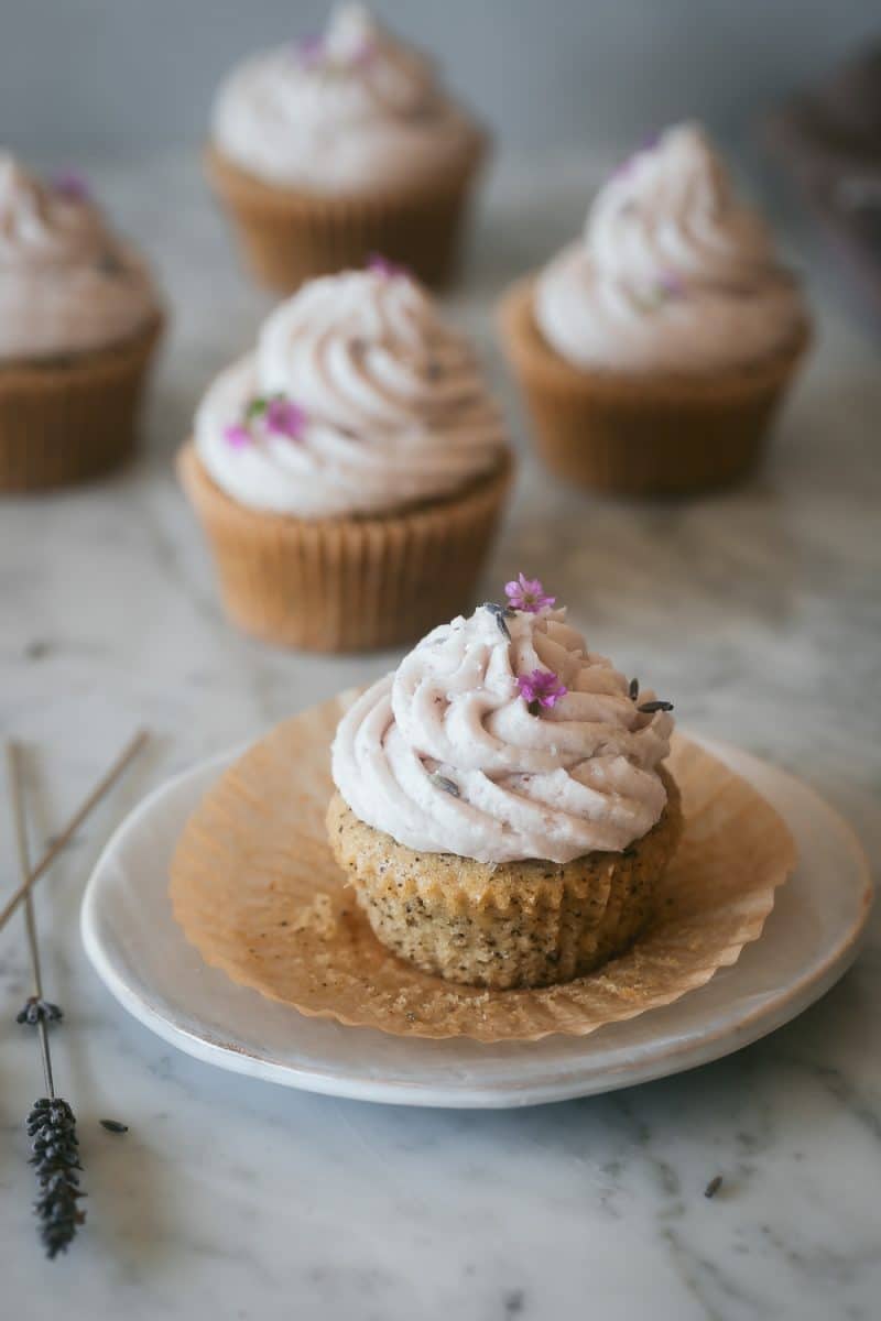 a vegan earl grey cupcake on a white plate